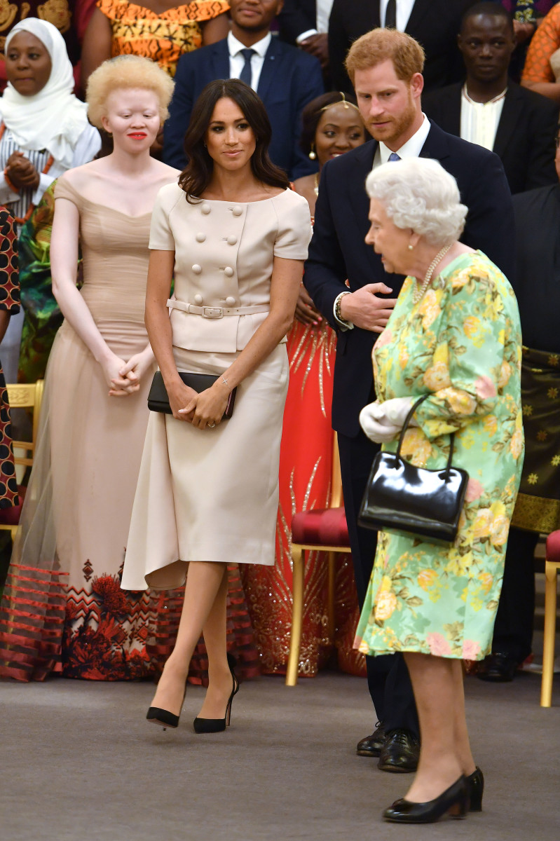 Meghan Markle, Duchess of Sussex, Prince Harry, Duke of Sussex and Queen Elizabeth II at the Queen's Young Leaders Awards Ceremony at Buckingham Palace in London, England. Photo:John Stillwell - WPA Pool/Getty Images