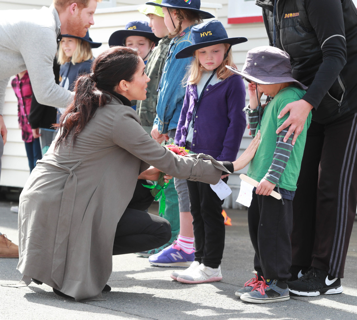 Is your heart not melting? The Duchess of Sussex Meghan Markle meeting a child in New Zealand. Photo: Ian Vogler/Pool/Getty Images