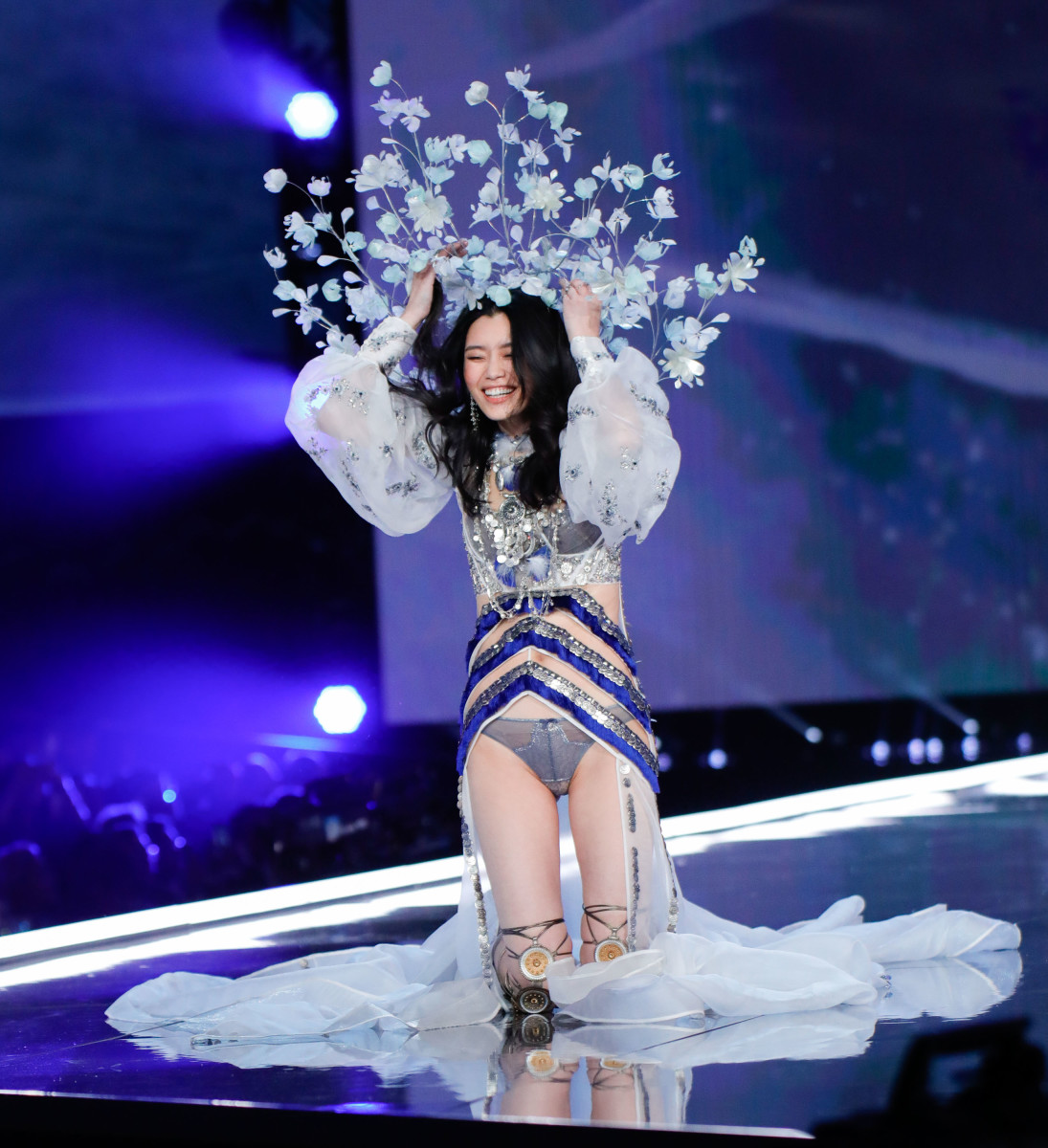 Ming Xi takes a tumble on the Victoria's Secret Fashion Show runway. Photo: J. Lee/FilmMagic