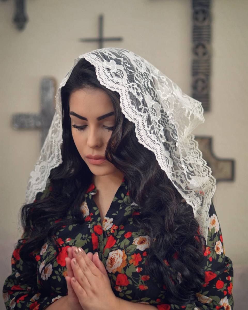 A young Catholic woman from Las Vegas regularly shares images of herself wearing flawless makeup and lacy chapel veils on Instagram. Photo: Courtesy Caramia Caballero