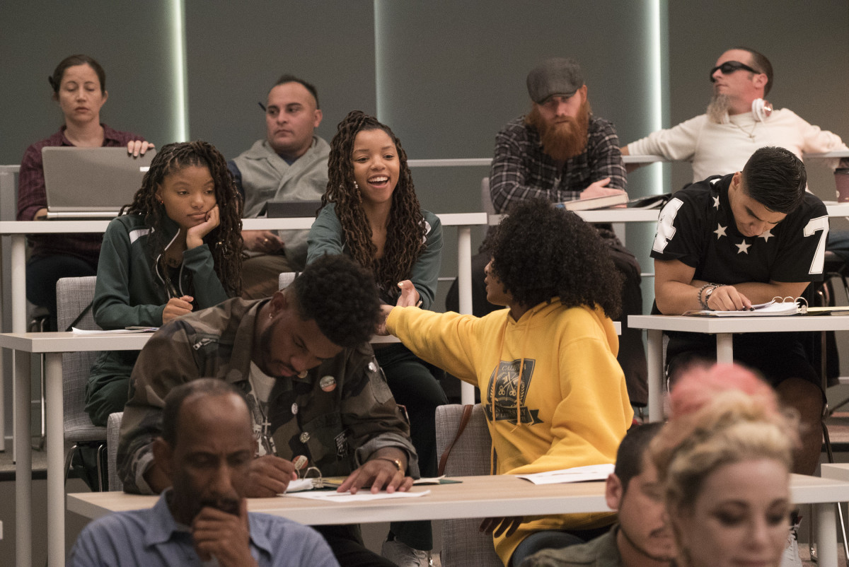 Jazz (Chloe Bailey) and Sky (Halle Bailey) in tracksuits, in the third row. Aaron (Trevor Jackson) and Zoey in the second row. Photo: Freeform/Kelsey McNeal