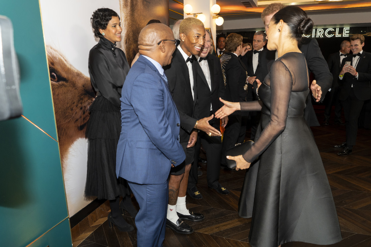 Pharrell and the Duchess of Sussex at the London premiere of "The Lion King." Photo: Niklas Halle'n-WPA Pool/Getty Images