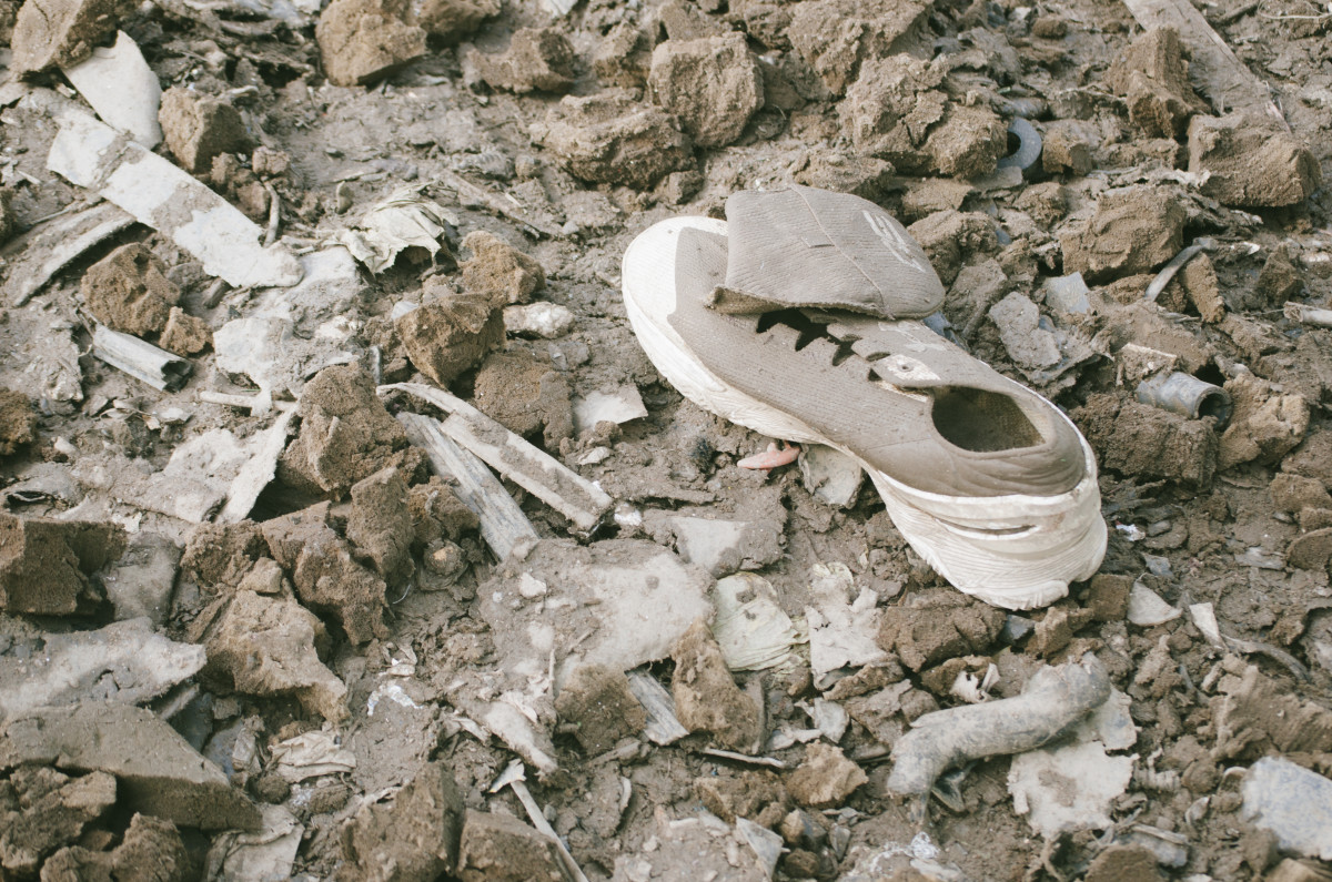 A discarded Under Armour shoe on top of the Fairless landfill. Photo: Whitney Bauck/Fashionista