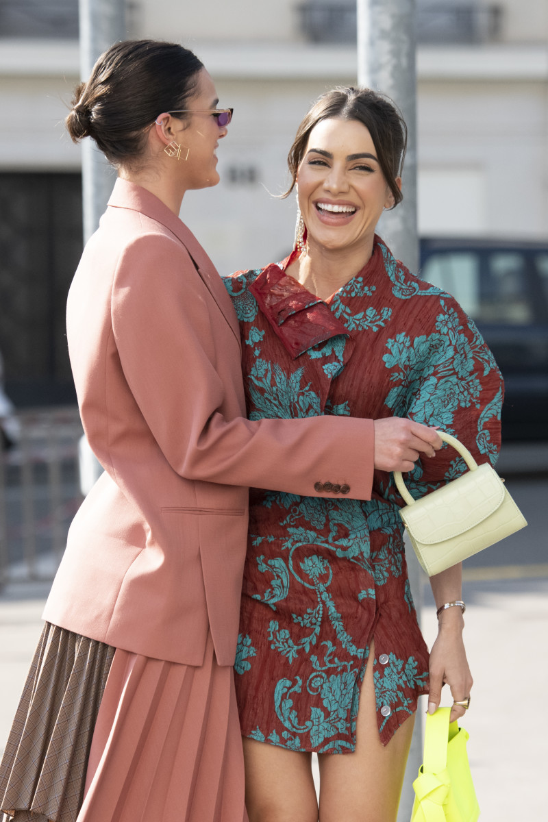 Bruna Marquezine — with Camila Coehlo — carrying a By Far Mini during Haute Couture Fashion Week in June 2019.