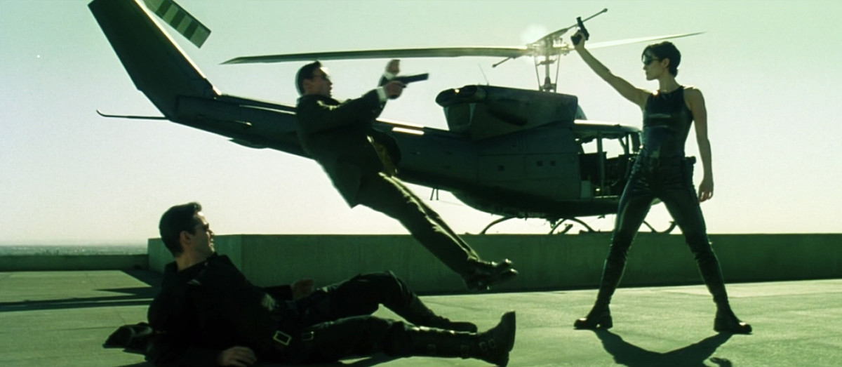 Neo (Keanu Reeves) being saved by Trinity (Carrie-Anne Moss), yet again. Photo: Screengrab/'The Matrix'