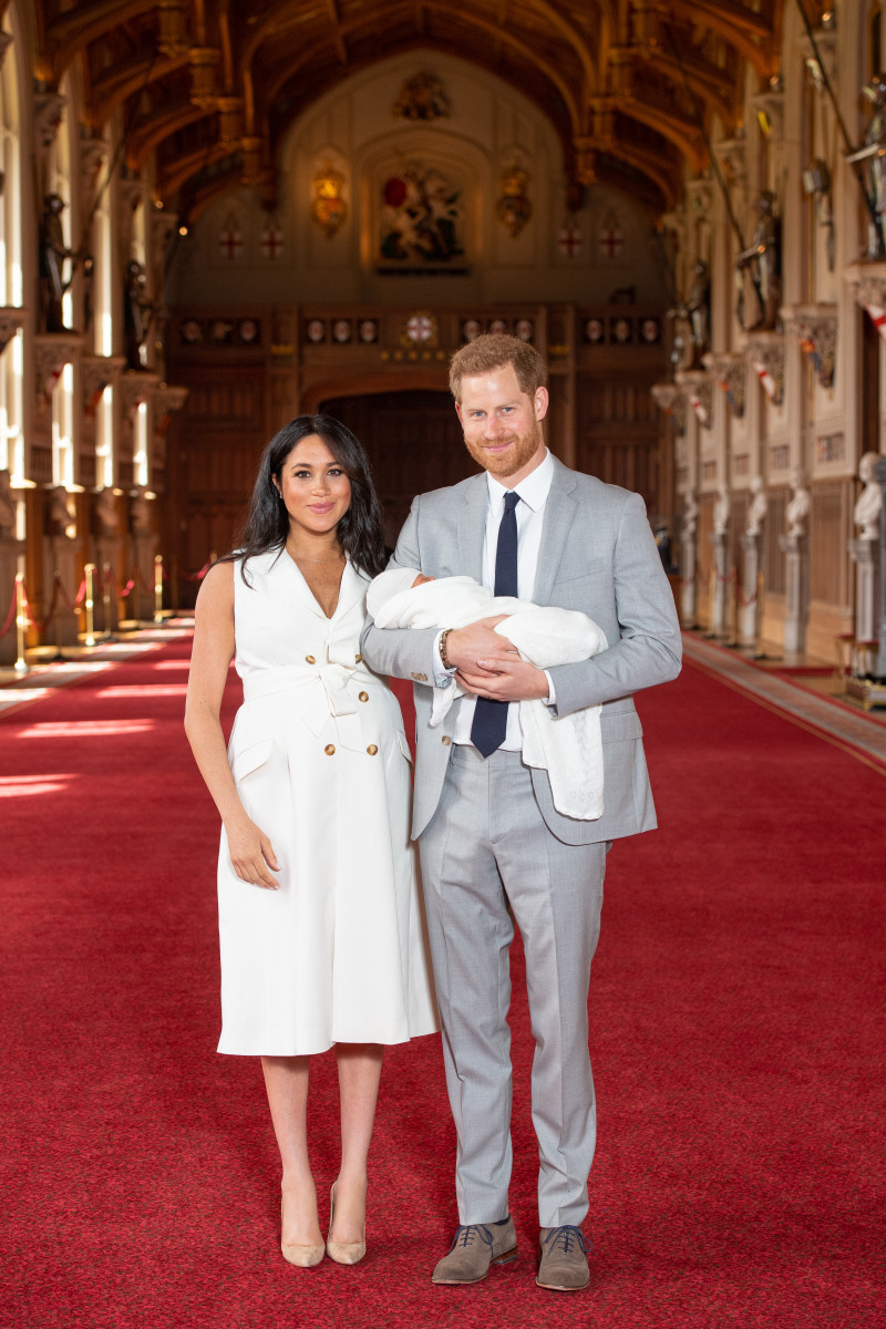 Meghan, Duchess of Sussex, in Wales Bonner, and Prince Harry, Duke of Sussex, with their newborn son in St George's Hall at Windsor Castle. Photo by Dominic Lipinski - WPA Pool/Getty Images