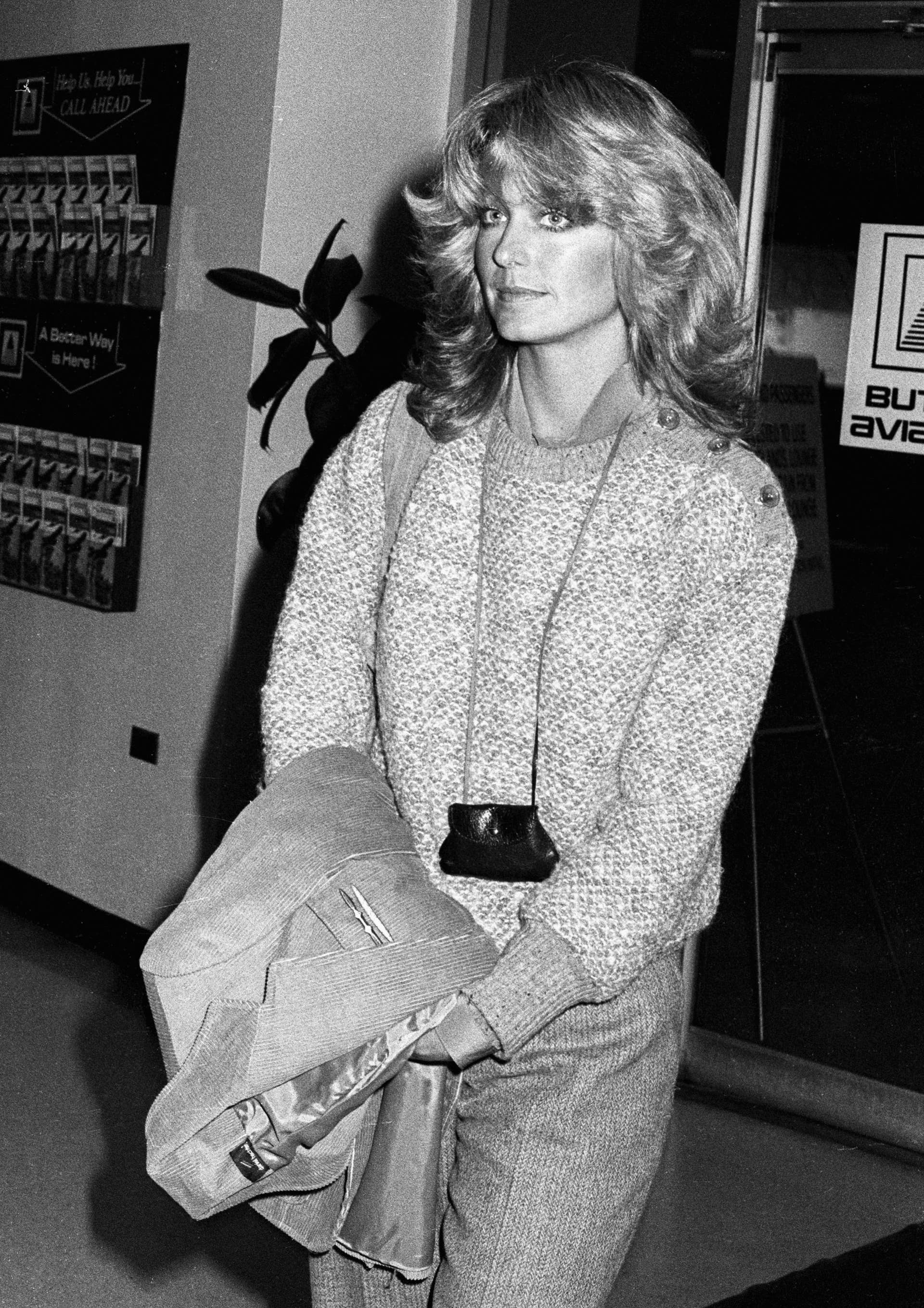 Great Outfits In Fashion History Farrah Fawcett s Neck Bag Fashionista