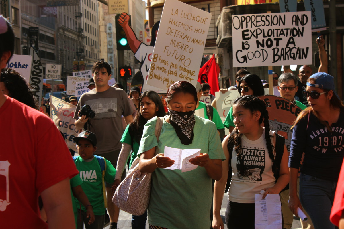 A group of protestors march through downtown L.A. in November 2017 as part of an "Anti-Sweatshop Saturday" demonstration against Ross.