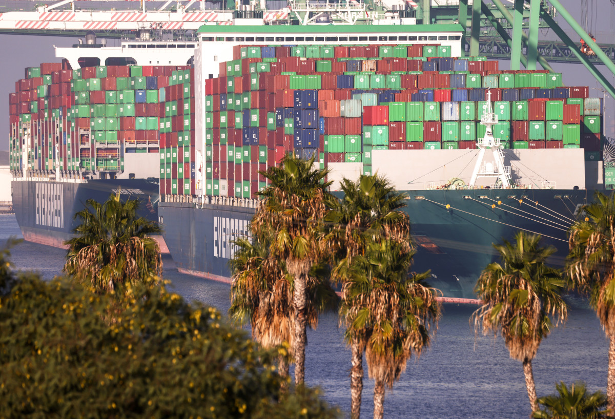hipping containers are stacked on container ships at the Port of Los Angeles on November 30, 2021 in San Pedro, California