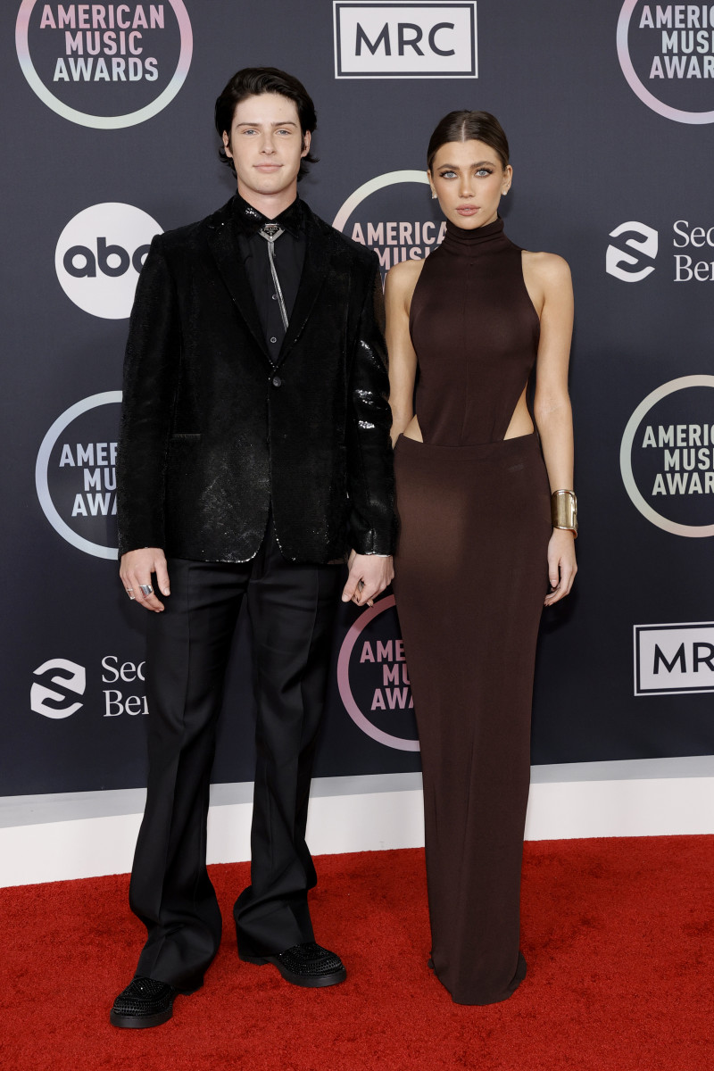 Zilber, with Blake Gray, attending the 2021 American Music Awards in a cutout Proenza Schouler gown, accessorized with Tiffany & Co. jewels.
