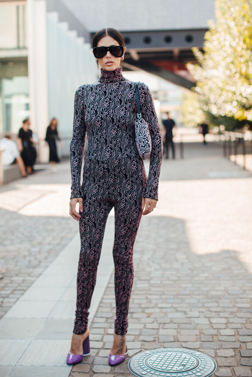A showgoer in a Prada catsuit during Milan Fashion Week.
