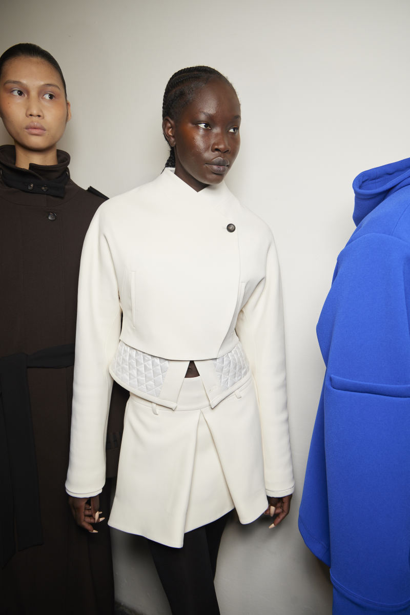 Models for Maximilian's Fall 2022 collection backstage at Fashion East's London Fashion Week show.
