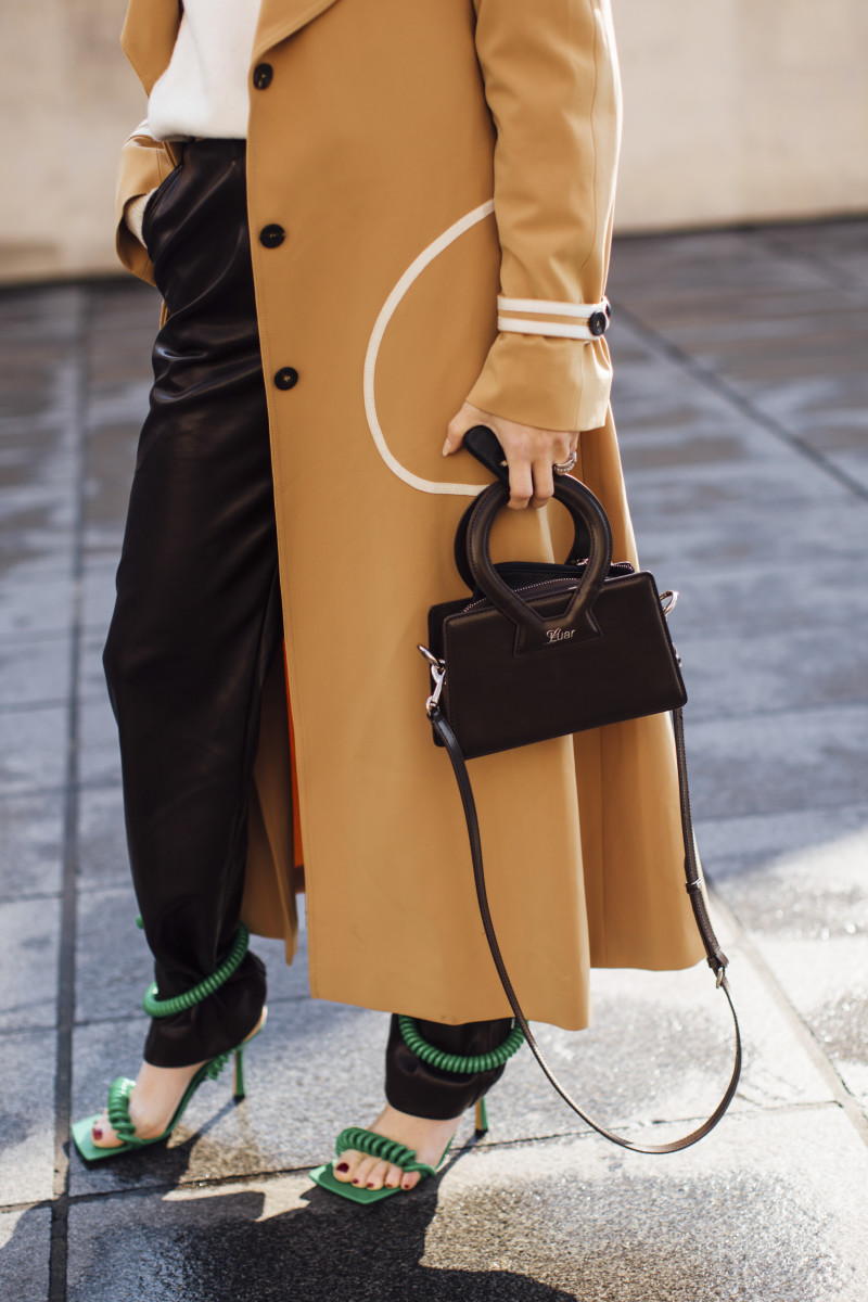 A showgoer carrying Luar's Ana bag during Paris Fashion Week. 