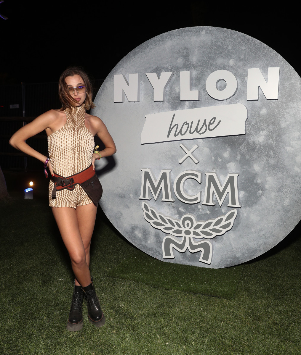 Emma Chamberlain wearing Knorts Knit Denim, vintage Miu Miu and R13 at Nylon House during Coachella 2022