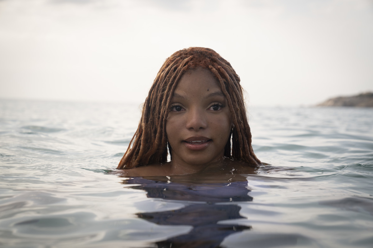 Ariel (Halle Bailey) takes a peek at humans and land.
