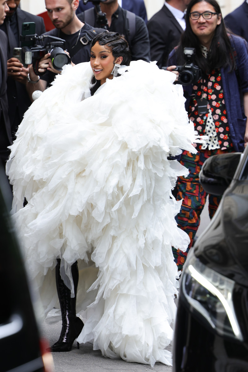 https://fashionista.com/.image/t_share/MTk5MTQ2NjYzMzYzNzQ5ODQ0/cardi-b-mvp-haute-couture-fall-2023-at-balenciaga-white-coat.jpg