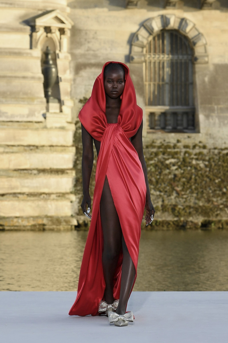 Editorial photograph of a red Valentino Haute Couture