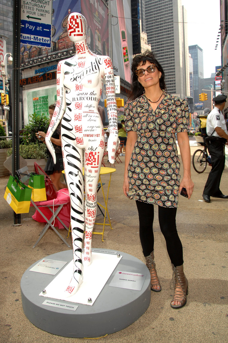 Norma Kamali with her mannequin for the "Fashion Center Sidewalk Catwalk" — featuring bar codes — in Manhattan's Herald Square in June 2010. 