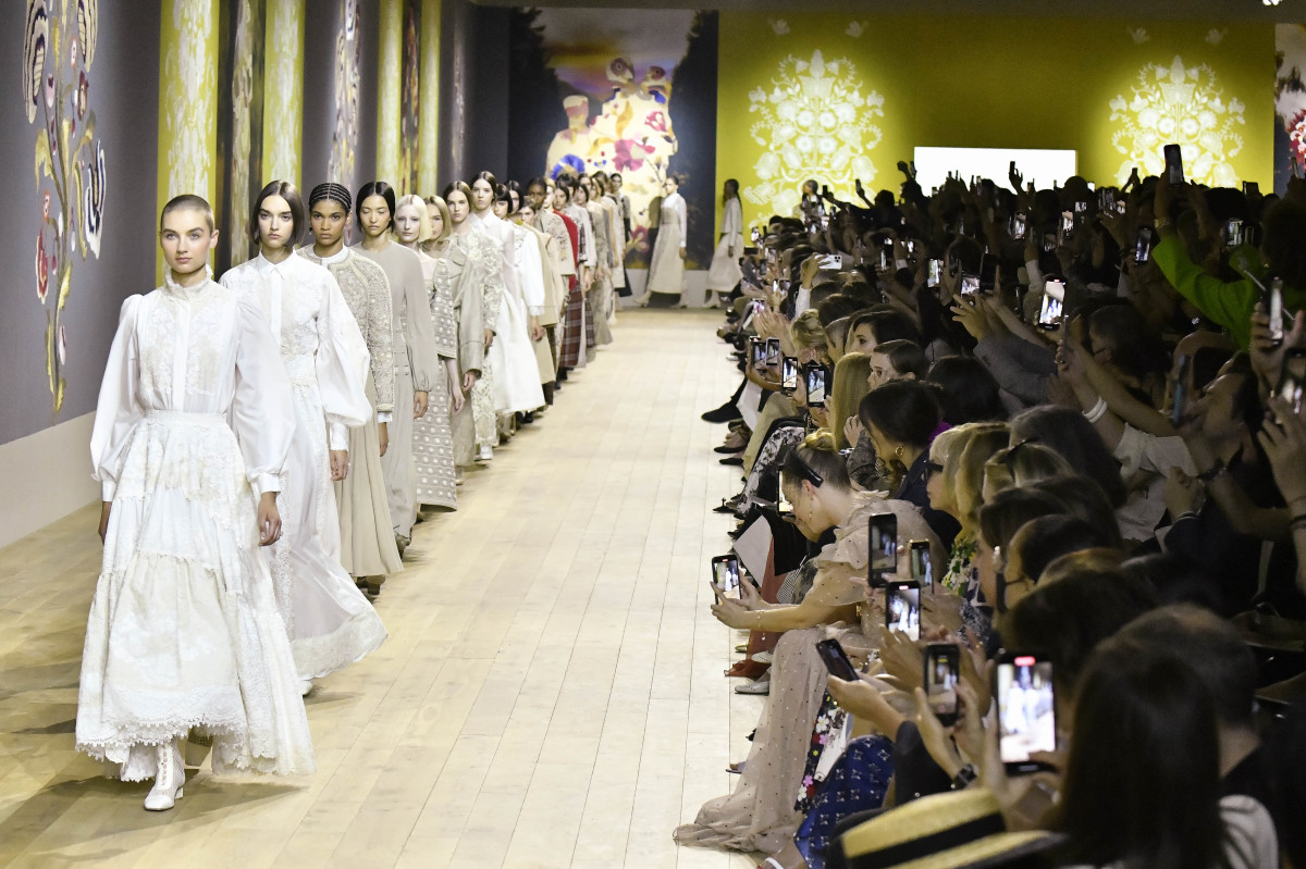 Models walk down the Dior Paris Haute Couture Runway.