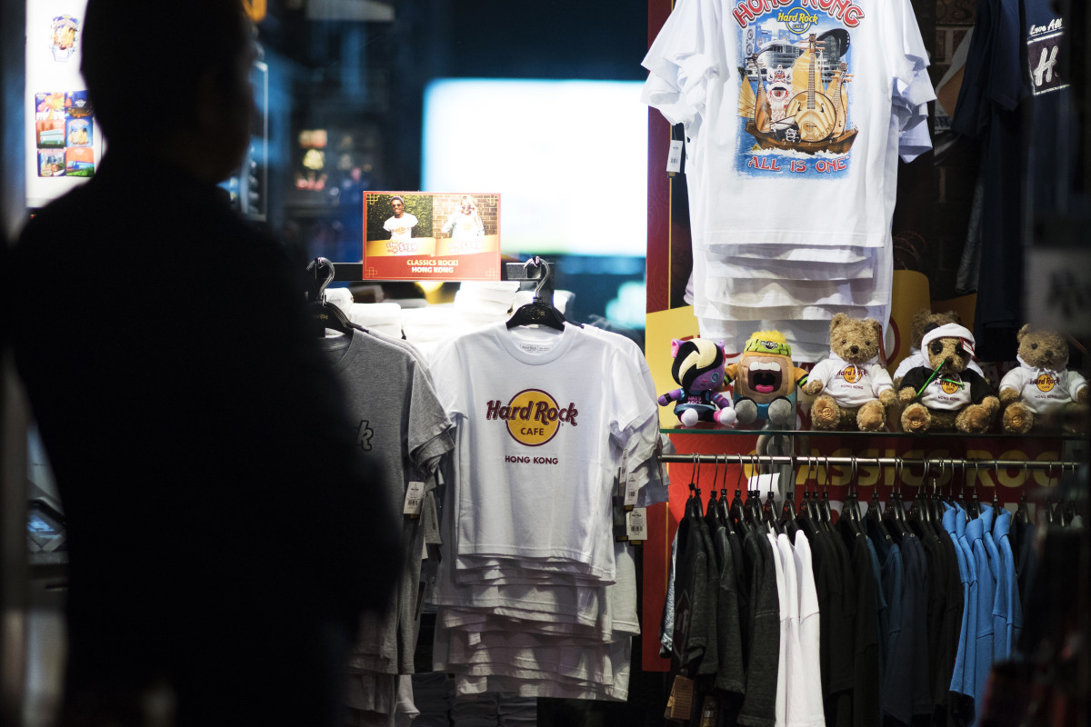 T-shirts and other merchandise are displayed for sale at the Hard Rock Cafe Hong Kong.