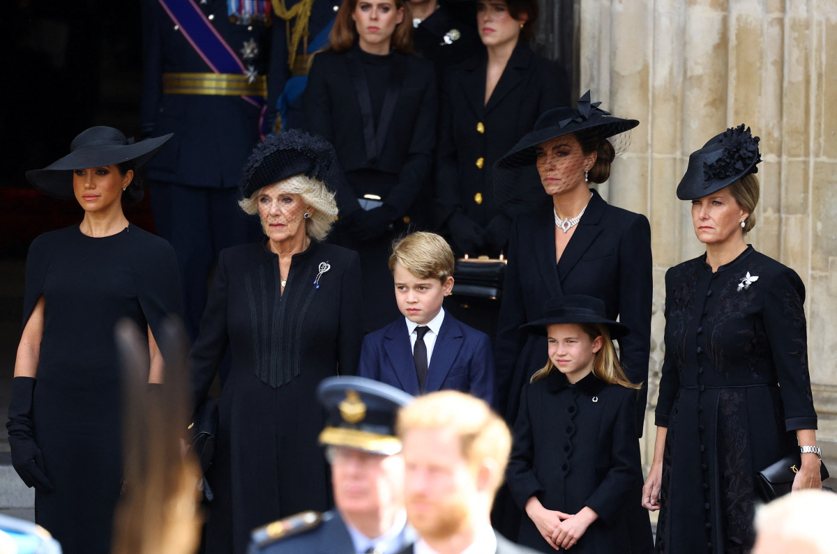 From left to right: Meghan, Duchess of Sussex, Queen Camilla, Prince George, Princess Charlotte, Catherine, Princess of Wales, and Sophie, Countess of Wessex attend Queen Elizabeth II's funeral Monday morning.