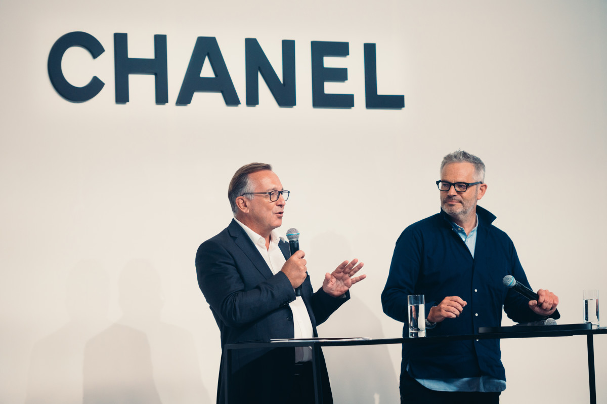 Chanel President of Fashion Bruno Pavlovsky with Tyler Brûlé onstage at a "master class" hosted by the brand the day after the Replica show.